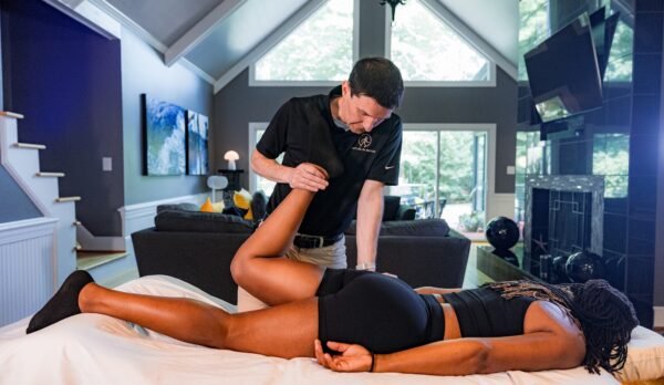 Doctor of Physical Therapy performing trigger point therapy and myofascial release